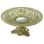 A Victorian gilt metal comport or tazza, with pierced decoration of scrolls, leaves etc.,