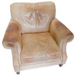 A late 20th/early 21stC pale brown leather armchair, in distressed condition, on square tapering