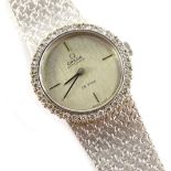 An 18ct white gold Omega De Ville ladies wristwatch, with circular dial with silvered dial and