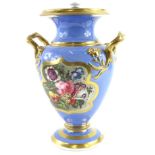 A mid 19thC English porcelain two handled vase and cover, painted with flowers, on a pale blue