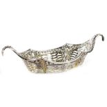 A late Victorian silver two handled boat shaped dish, with pierced sides, engraved NDC 1878-1928,
