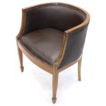 A late 19th/early 20thC mahogany and satinwood banded tub shaped chair, upholstered in brown