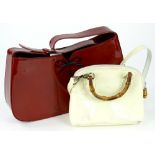 Two ladies patent leather handbags, to include a Gucci bamboo handle bag in cream and a Balenciaga