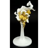 A Lladro porcelain candlestick, decorated with shells, scrolls etc., 33cm H.