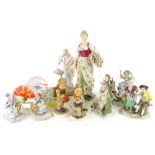 Miscellaneous items, to include Continental porcelain figures, glass paperweights etc.