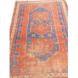 Withdrawn from sale - Retained by the Executors. A Turkish rug, with three medallions on a blue