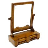 A Victorian mahogany swing frame dressing table mirror, with a rectangular plate, the base with