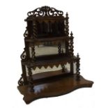 A Victorian figured walnut wall hanging whatnot, with fret work decoration, around three rectangular