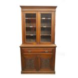 A late Victorian walnut cabinet secretaire bookcase, with moulded cornice, two moulded and glazed