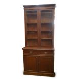 A late Victorian mahogany cabinet bookcase, with moulded cornice two glazed doors revealing