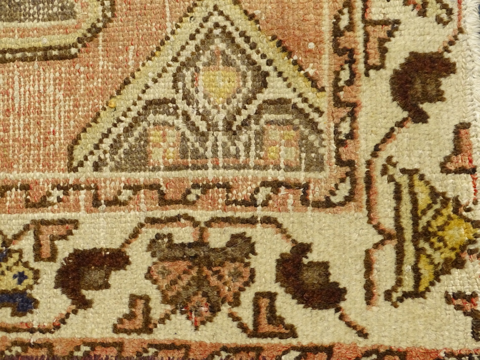 An Azari rug, with a central medallion on a red ground with one wide border, (AF), 190cm x 125cm. - Image 2 of 3