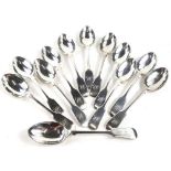A set of twelve Victorian silver fiddle pattern tea spoons, each engraved with initials, Sheffield