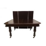 A Victorian mahogany extending dining table, with moulded top and frieze on octagonal inverted
