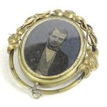 A Victorian memorial brooch, with central figure, believed to be John Charles Rudkin of Derby,