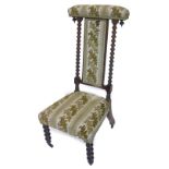 A Victorian mahogany prie dieu chair, with a padded back and seats, bobbin turned supports and