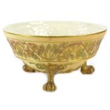 A Grainger Worcester blush ivory bowl, decorated in relief with leaves, scrolls etc., on paw feet,