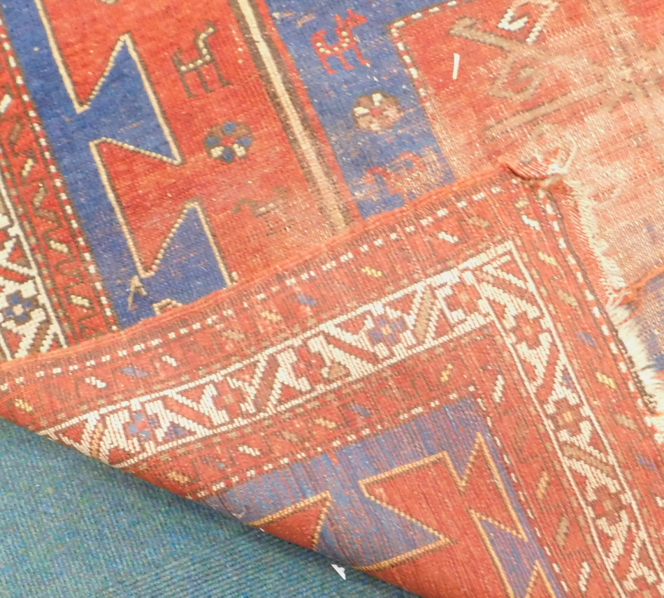 Withdrawn from sale - Retained by the Executors. A Turkish rug, with three medallions on a blue - Image 3 of 3