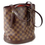 A Louis Vuitton Damier Ebene petit bucket bag, with matching pouch.