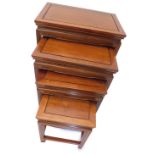 A nest of four Chinese hardwood tables, each with a rectangular top and moulded legs, the largest