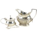 Two items of small silver, a milk jug with part fitted decoration, Assay mark rubbed, 2¾oz, and a