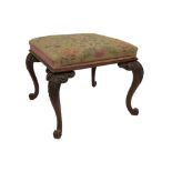 A Victorian mahogany stool, with floral Berlin wool work seat and raised on four acanthus carved