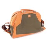 A Dunhill weekend bag, in brown with orange leather trim.