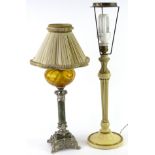A Continental table lamp, modelled in the form of an oil lamp, with an amber tinted glass reservoir,