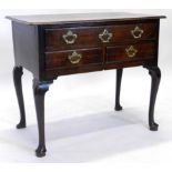 An 18thC oak lowboy, the rectangular top with a moulded edge, above an arrangement of one long and