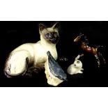 A collection of ceramics, to include a Beswick recumbent Siamese cat, Beswick foal, Beswick Nuthatch