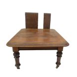 A Victorian mahogany pull out dining table, with double moulded top, scroll carved and matted