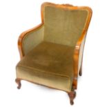 An early 20thC continental beech armchair, upholstered in green fabric on cabriole legs.