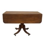 A Regency mahogany Pembroke table, with rounded rectangular drop leaf top, two frieze drawers with