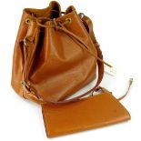 A Louis Vuitton Epi leather drawstring shoulder bag, in tan with associated pouch.