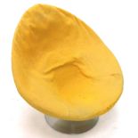A retro style large tub chair, upholstered in yellow textured fabric, on brushed metal circular