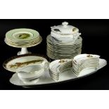 A collection of fish related ceramics, to include a porcelain part service, decorated with exotic