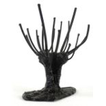 An unusual ebonised metal Scandinavian sculpture, modelled in the form of a stylised tree, label