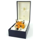 A Halcyon Days enamel box, the fox head stirrup cup inspired by a Derby porcelain original from