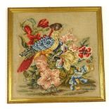 A Victorian raised wool work, picture of an exotic bird, flowers etc., with linen backing, 44cm x
