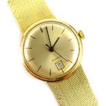 An 18ct gold wristwatch, with circular watch head 2.5cm dia, with automatic movement, on a brushed