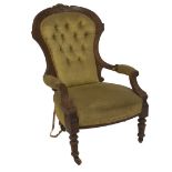 A Victorian walnut ladies armchair, with rosette and floral scratch carving, 70cm W.