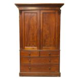 An early Victorian mahogany linen press, with moulded cornice over two flamed bead moulded