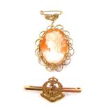 A 9ct gold Royal Army Medical Corps bar badge, 2.3g, a 9ct gold and shell cameo brooch, bust