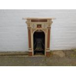 A Victorian cast iron bedroom fire surround, cast with fruit and foliage, later over painted, 93cm