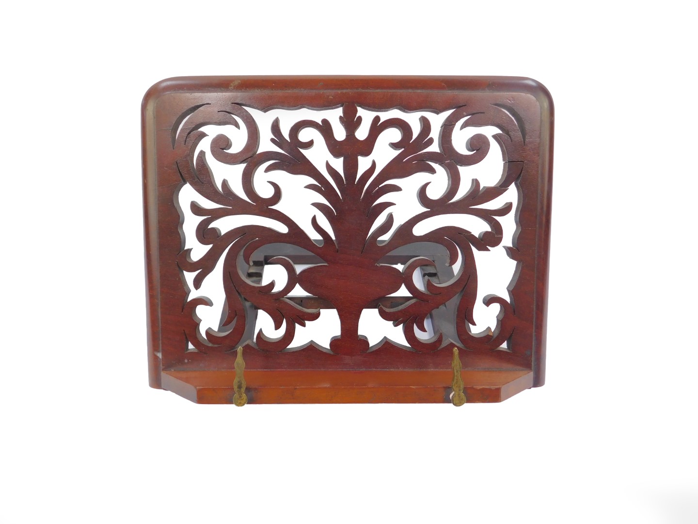 A Victorian mahogany book lectern, with fretwork foliate scroll and vase decoration, on a ratchet