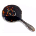 A George V silver and tortoiseshell hand mirror, with pique decoration of a wreath and flowers,