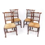 A set of four George III ash spindle back single dining chairs, possibly Lancashire, with rush