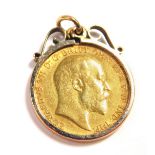An Edward VII gold half sovereign 1909, in a 9ct gold pendant mount, 5.2g all in.