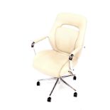 A cream leather and cast metal swivel office chair, on castors.