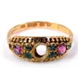 A Victorian 15ct gold and gem set ring, central stone lacking, flanked by amethysts and emeralds,