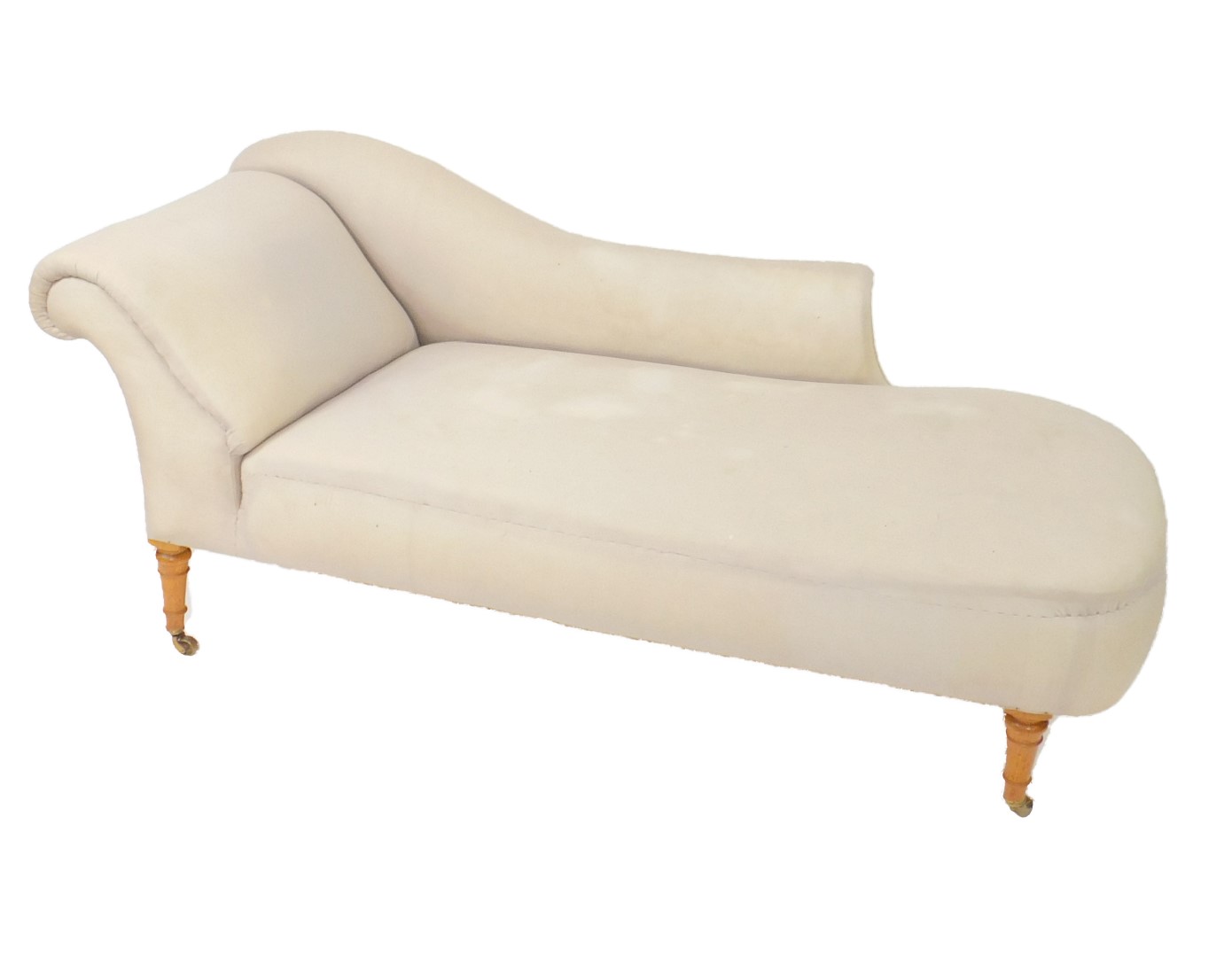 A Victorian oak chaise longue for reupholstery, raised on turned legs, brass capped on castors,